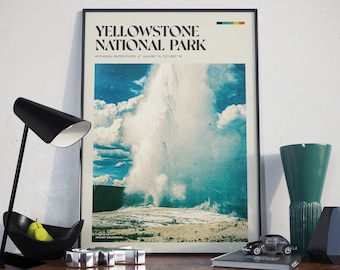 May include: A vintage-style poster with a black frame featuring a photograph of a geyser erupting in Yellowstone National Park. The poster has the text "Yellowstone National Park" in bold black letters and the text "Wyoming, United States // 44.4280° N, 110.5883° W" in smaller black letters.