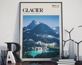 May include: A black framed poster with a photograph of a mountain range and a lake. The poster has the text "GLACIER NATIONAL PARK" and "MONTANA, USA / 48.7296° N, 113.7870° W" printed on it.