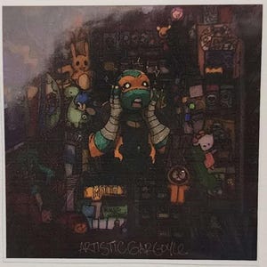 May include: An illustration featuring a Teenage Mutant Ninja Turtle with a shocked expression, surrounded by various cartoon characters and objects. The artwork has a dark, textured background with the text "ARTISTIC GARGOYLE" at the bottom.