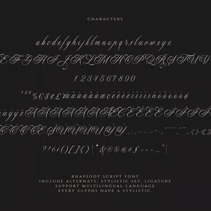 May include: A font chart showcasing the characters, numbers, and symbols included in the Rhapsody Script font. The font is a cursive script style with a flowing, elegant appearance. The chart includes uppercase and lowercase letters, numbers 0-9, and various punctuation marks and symbols.