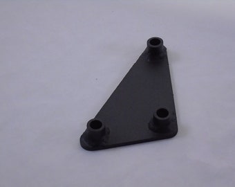 May include: A black metal triangular bracket with three round holes. The bracket is designed for mounting or attaching objects.