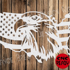 May include: A white silhouette of an eagle with its head turned to the right, superimposed over an outline of the United States. The eagle's eye is visible, and the outline of the United States is filled with the stars and stripes of the American flag. The text "CNC READY" is visible in a red circle in the lower right corner of the image.
