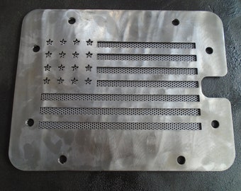 May include: A metal American flag design with a perforated pattern. The flag is made of a silver metal and has a distressed look. The stars are cut out of the metal and the stripes are made of a perforated pattern.