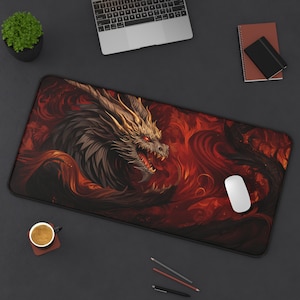 May include: A red and black dragon mouse mat with a detailed illustration of a dragon with gold accents. The dragon is set against a background of swirling flames and smoke.