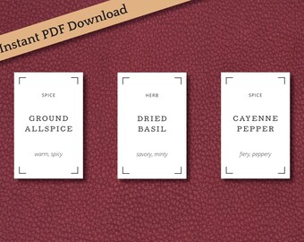 May include: Three white printable spice jar labels with black text. The labels read "Ground Allspice", "Dried Basil", and "Cayenne Pepper". Each label includes a brief description of the spice's flavor profile.