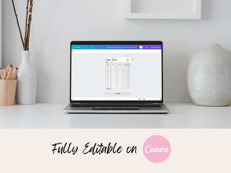 May include: A laptop displays an "Order Tracker" template with pink accents. The text "Fully Editable on Canva" is below the laptop. A white vase with branches and a wooden pencil holder are on the left. A textured white vase is on the right.