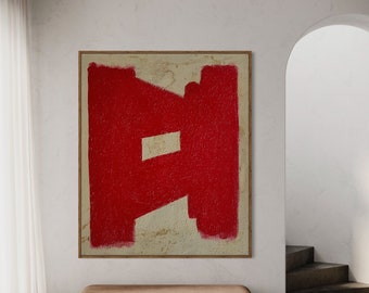 May include: A red abstract painting with a textured background hangs on a white wall above a brown wooden bench. The painting is framed in a thin wooden frame.