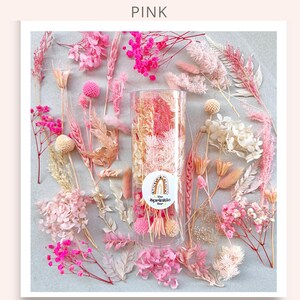 May include: A clear glass jar filled with pink and white dried flowers. The jar has a sticker on it that says "The Sprinkle Bar". The jar is surrounded by a variety of dried flowers in pink, white, and beige.