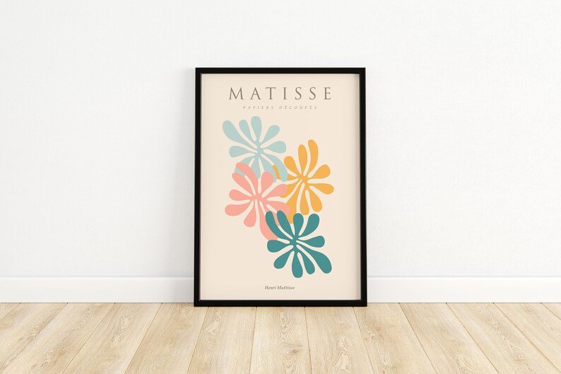 May include: A framed print with a minimalist design featuring abstract floral shapes in shades of blue, pink, and yellow. The print is titled "Matisse" and includes the text "Paris et decoupes" and "Henri Matisse".
