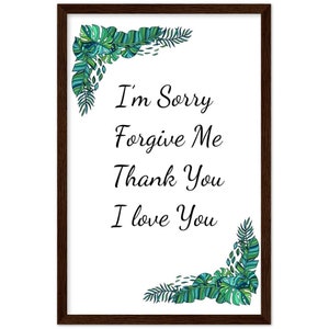 Może przedstawiać: Wydruk w ramie z białym tłem i zielonymi tropikalnymi liśćmi w rogach. Tekst "I'm Sorry Forgive Me Thank You I Love You" jest napisany czarnym kursywą.