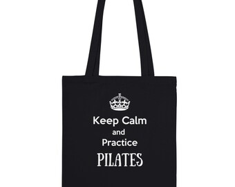 May include: Black tote bag with white text that reads "Keep Calm and Practice PILATES".