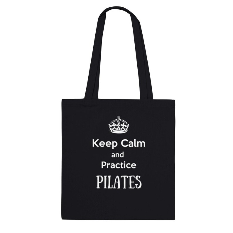 May include: Black tote bag with white text that reads "Keep Calm and Practice PILATES".