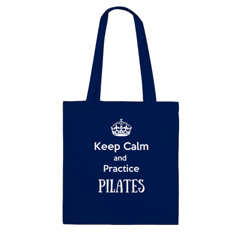 May include: A navy blue tote bag with white text that reads "Keep Calm and Practice PILATES".