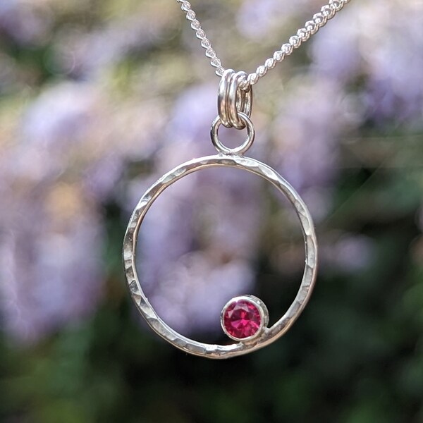 Recycled handmade silver necklace with a vibrant pink CZ stone