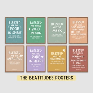 May include: Eight framed posters with inspirational text from The Beatitudes. Each poster has a different coloured background and features a quote with the words "Blessed" and a related virtue. The bottom of the image reads "THE BEATITUDES POSTERS."