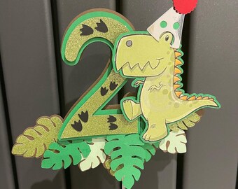 3D dinosaur cake topper with party hat
