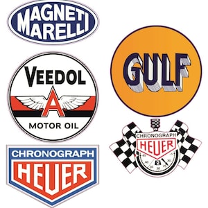 May include: Five vintage car racing themed stickers. The stickers are round and oval shaped with white borders. The stickers feature the logos for Veedol Motor Oil, Gulf, Magneti Marelli, and Heuer Chronograph.