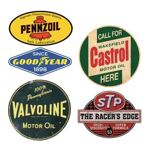 May include: Five vintage-style round and oval signs with various motor oil brands. The signs are red, green, yellow, and blue with white text. The brands include Pennzoil, Goodyear, Valvoline, Castrol, and STP.