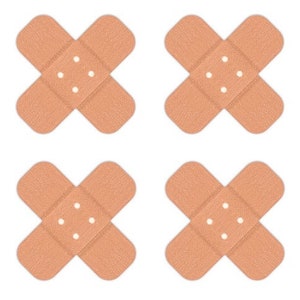 May include: Four brown fabric adhesive bandages with white adhesive centers. Each bandage is shaped like a cross.