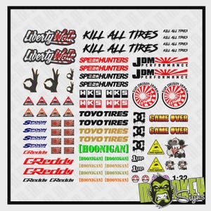 May include: A sheet of stickers with automotive and racing-themed logos and text. Includes "Kill All Tires," "Speedhunters," "Toyo Tires," and "Greddy" in red, white, and black. Also features Japanese flag imagery and a cartoon monkey.