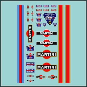 May include: A selection of Martini Racing decals and stripes in red, blue, and gold on a light blue backdrop. Features various Martini Racing logos and text elements, suitable for automotive enthusiasts.
