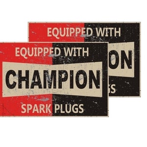 May include: Two vintage-style signs with a red and black background. The top sign says "Equipped with Champion Spark Plugs". The bottom sign says "Equipped with Champion".