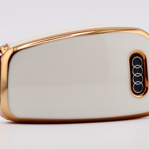 Back of White key cover on Audi key fob.