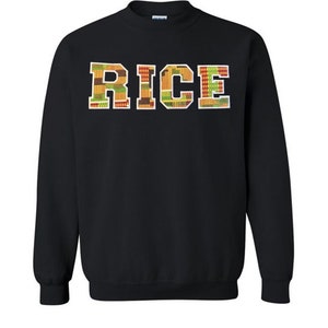 May include: Black sweatshirt with the word "RICE" printed in large, white outlined letters. The letters are filled with a colorful pattern of red, yellow, and green.