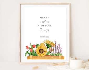 May include: A printable wall art print with a watercolor illustration of a flower box with sunflowers, lavender, and tulips. The text reads "My cup overflows with your blessings, Psalm 25:5".