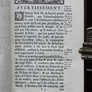 May include: A black and white page from an old book with text in French about the history of the Jewish people. The text includes the words "Avertissement" and "Efdras".