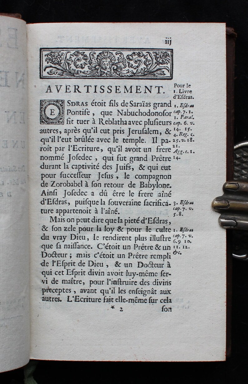 May include: A black and white page from an old book with text in French about the history of the Jewish people. The text includes the words "Avertissement" and "Efdras".