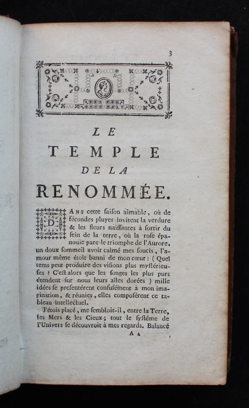May include: A page from an antique book with a decorative border and the title "LE TEMPLE DE LA RENOMM&Eacute;E." The text describes a dreamlike vision of nature and the universe.