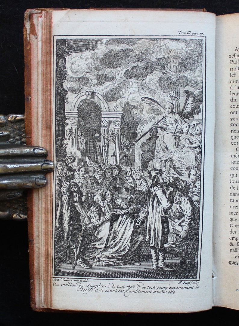 May include: A black and white engraving depicting a scene of people kneeling and bowing before a figure with wings. The figure is seated on a throne and holding a staff. The engraving is titled "Un million de Supplians de tout efat et de tout rang environnent la Decife et se courbent humblement devant elle."