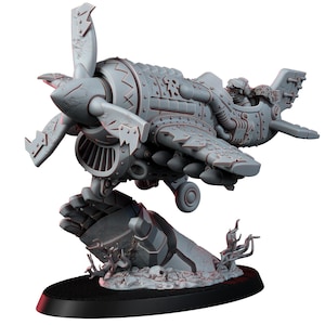 May include: A detailed gray model airplane with a propeller, rivets, and a pilot figure. The plane rests on a stylized hand base with skulls and debris. The model is designed with intricate mechanical details, suggesting a steampunk or fantasy theme.