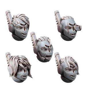 May include: Five gray, stylized miniature heads with various expressions. Each head features a unique hairstyle and a futuristic headset design. The faces display emotions ranging from smiling to a grimace, suitable for miniature figures.