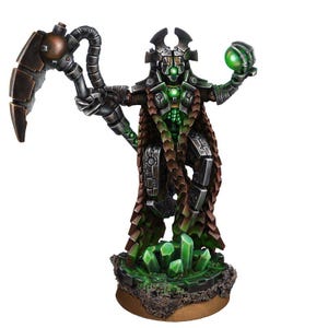 May include: A detailed miniature figure of a robotic warrior with a scythe and a glowing green orb. The figure has a metallic body with brown and green accents, standing on a base with green crystal formations. The overall design suggests a science fiction or fantasy theme.