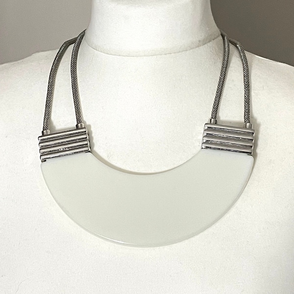 Vintage Art Deco machine age large white plastic and silver tone statement bib necklace, possible Jakob Bengel