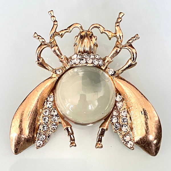 Large clear plastic cabochon jelly belly style fly / bee insect brooch, with clear rhinestones set in gold tone