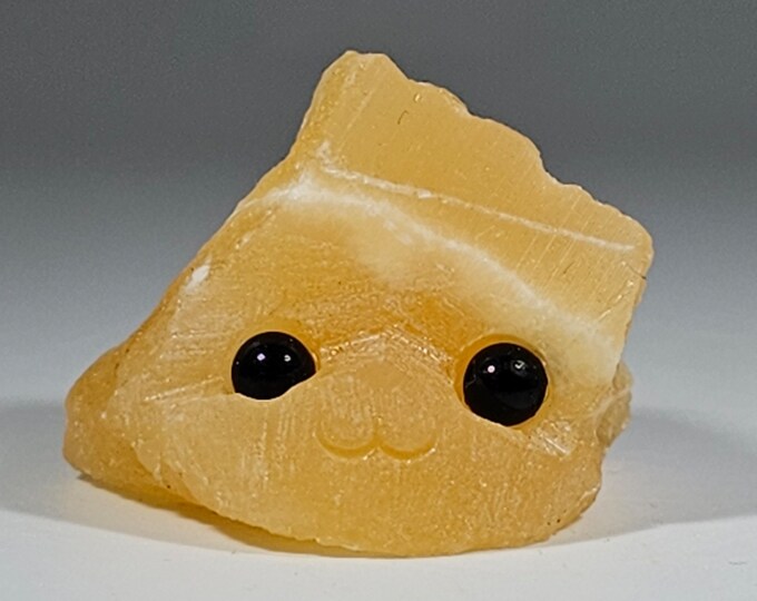 Orange Calcite Pet Rock Carving