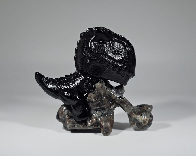 Obsidian Dinosaur on Yooperlite Motorcycle Carving