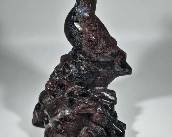 4" Garnet in Arfvedsonite Crow on Skulls Carving