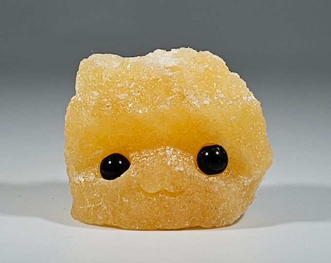 Orange Calcite Pet Rock Carving