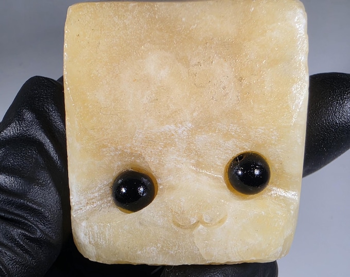 Orange Calcite Pet Rock Carving