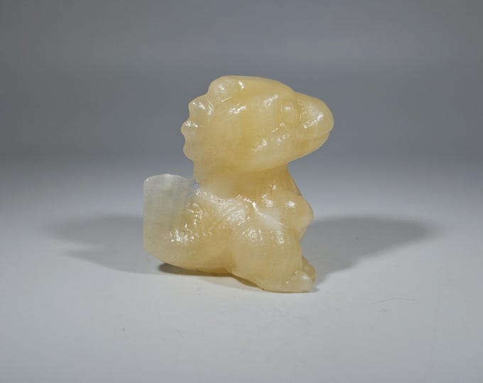 Orange Calcite Dinosaur Carving 1.6"