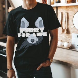 May include: Black t-shirt with a grey wolf head graphic and the text "Furry for Life" printed on the front.