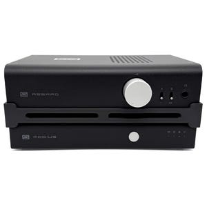May include: A black Schiit Asgard headphone amplifier stacked on top of a Schiit Modius digital-to-analog converter. The top unit features a large silver volume knob, two toggle switches, and a headphone jack. Both units display their brand logos.