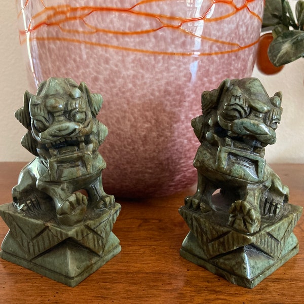 Marked Early 20th Century Pair of  natural green stone Foo Dog lions. Hand carved with detailed features. Natural Stone. 4" x 2" x1. 5"