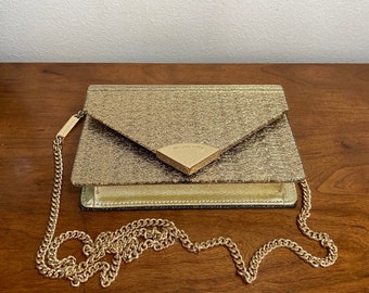 Vintage Fashionista Stunning Envelope style Gold-tone detachable shoulder bag to evening clutch from Michael Kors. Fashion gifts, designer