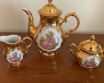 1950s detailed Victorian couple picnicking scene 22k painted tea pot with matching Creamer and sugar bowl in Exceptional condition!