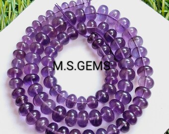 May include: A strand of purple amethyst beads, approximately 6mm in diameter, strung on a thin thread. The beads are smooth and polished, with a slight variation in color and shape. The text "M.S. GEMS" is visible on the white background.